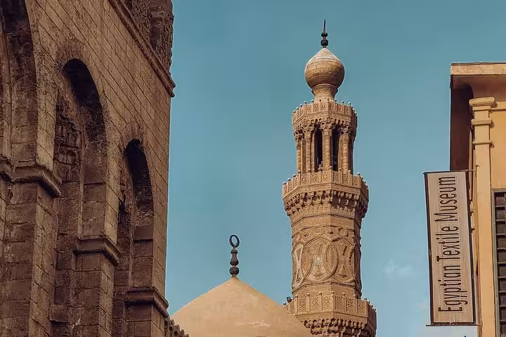 Ornate minaret near Egyptian Textile Museum in Islamic Cairo, Medieval Cairo old city heritage walking tour