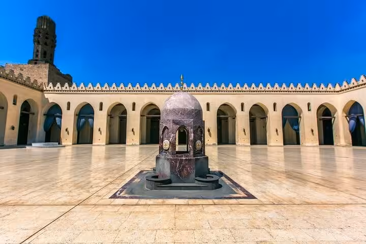 Sunlit courtyard and ablution fountain at historic mosque in Islamic Cairo, highlight of guided walking tour
