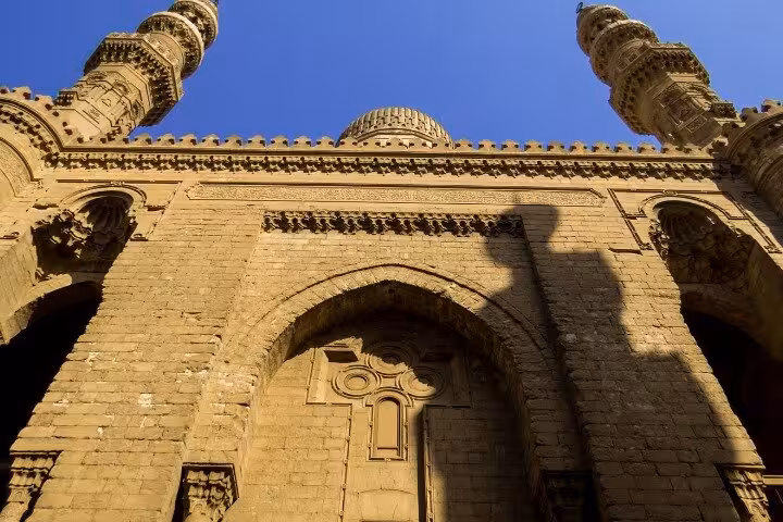 Historic Islamic Cairo mosque facade with twin minarets, featured stop on Discover Cairo's Historic Gems NEMIC