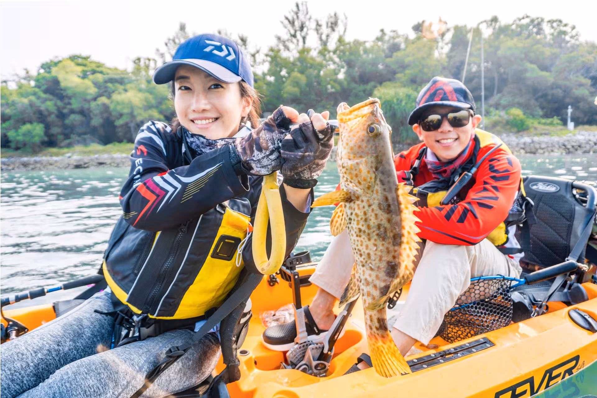 Happy anglers on Saint John Island kayaking experience displaying their fresh catch.