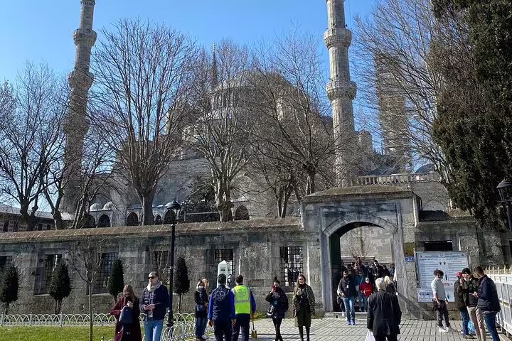 Visitors entering Istanbul’s Blue Mosque courtyard, a highlight of the 7-day small group Istanbul Cappadocia Ephesus tour