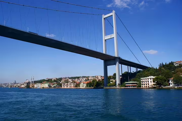 Bosphorus cruise view of the 15 July Martyrs Bridge in Istanbul, part of a private flexible city tour
