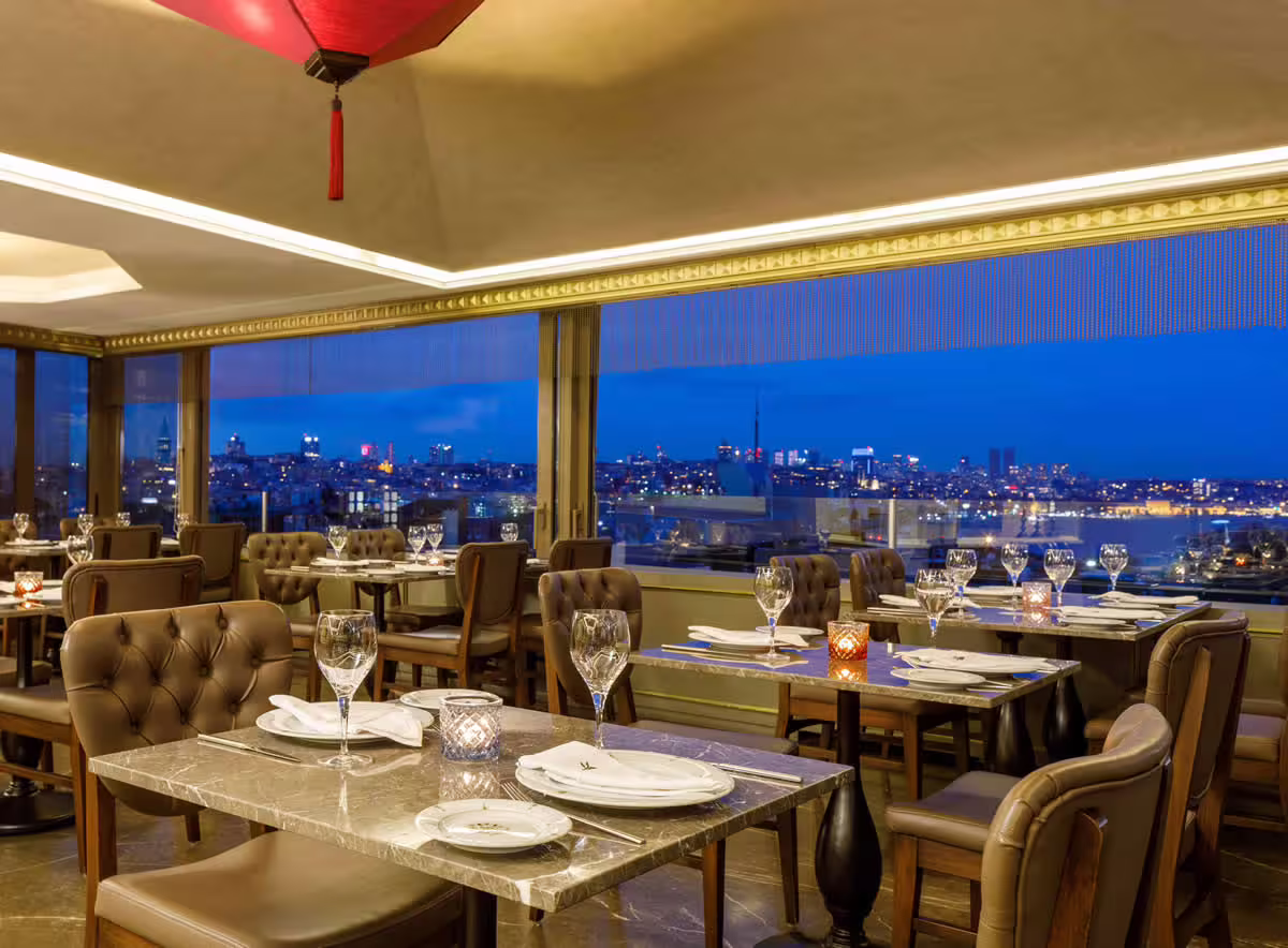 Elegant rooftop restaurant with Bosphorus night views, ideal dining on Istanbul & Ephesus 5-day guided tour