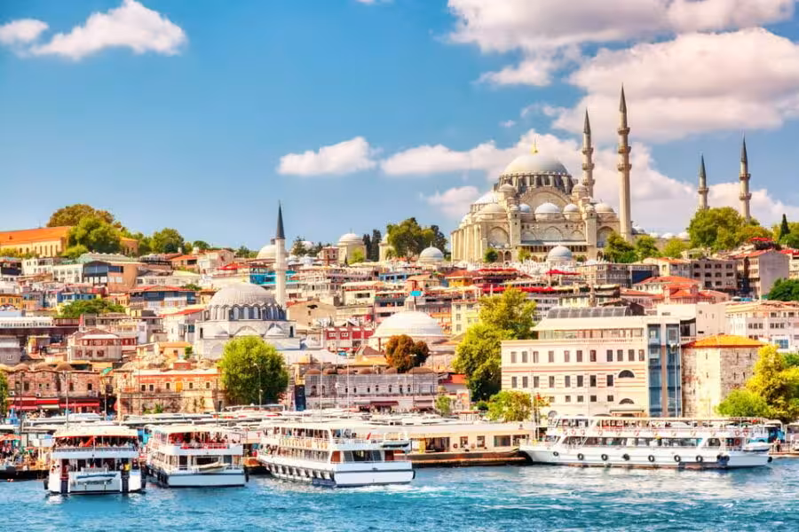 Istanbul waterfront skyline with mosques and Bosphorus cruise boats on 5-day Istanbul Cappadocia tour