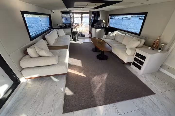 Spacious yacht salon with panoramic windows for a private Istanbul Bosphorus yacht cruise experience
