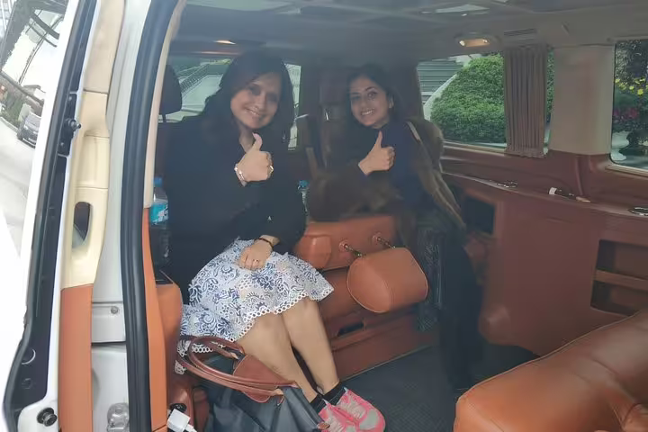 Guests giving thumbs up inside luxury private van for a flexible Istanbul city tour with personal driver