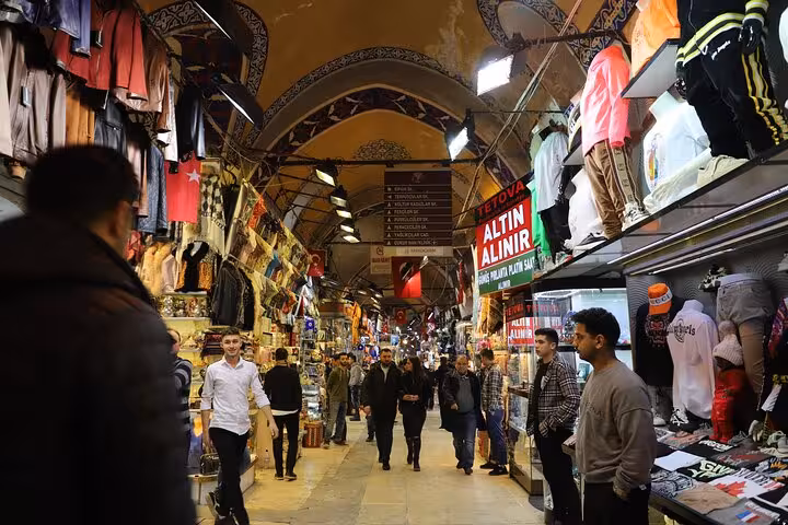 Busy aisle inside Istanbul Grand Bazaar with shoppers and stalls on Old City full-day tour with lunch