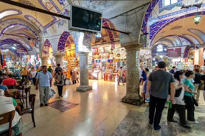 Grand Bazaar interior with shoppers and colorful arches on Istanbul private mini group shore excursion from port