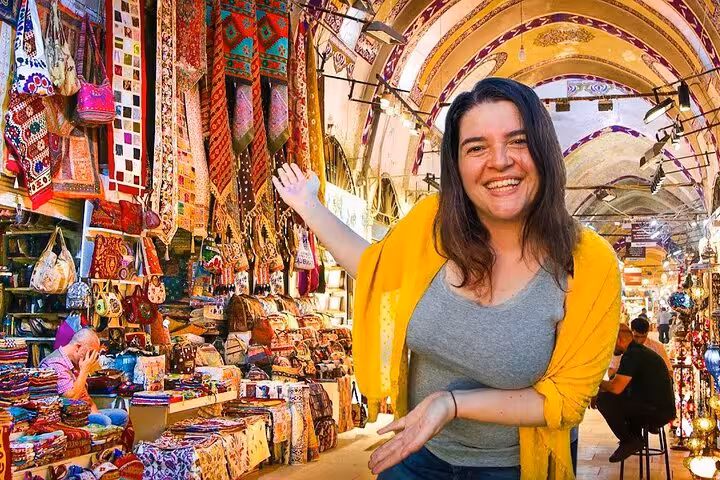 Traveler shopping for colorful textiles in Istanbul Grand Bazaar on Byzantine and Ottoman city tour with lunch