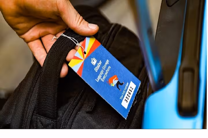 Close-up of tagged suitcase for Istanbul luggage storage service, secure bag drop with booking reference label