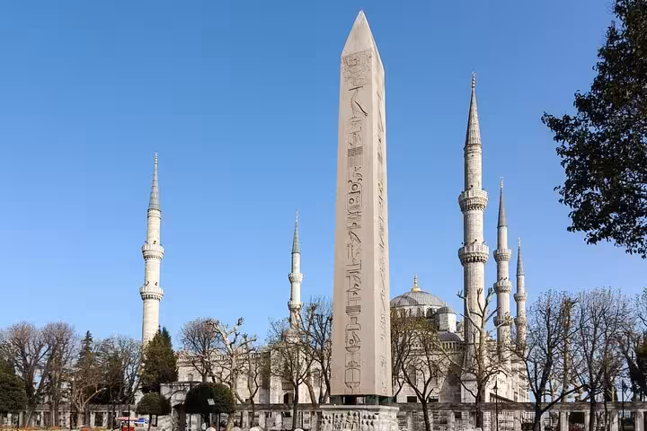 Obelisk at Sultanahmet Square with Blue Mosque minarets, private Istanbul shore excursion from port