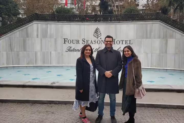 Travelers posing at the iconic Four Seasons Hotel in Istanbul, a highlight of the private full-day tour.