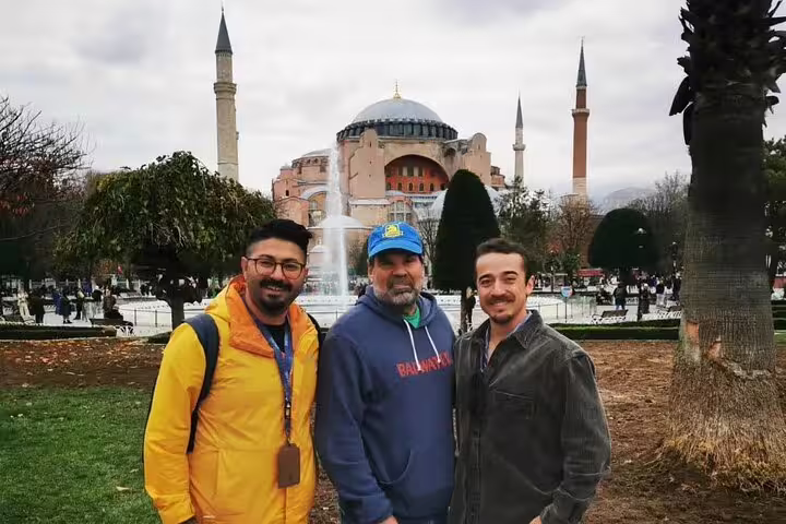 Visitors enjoying a private tour in front of the iconic Hagia Sophia in Istanbul, showcasing its stunning architecture.