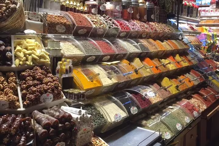 Istanbul Spice Bazaar counters with colorful Turkish spices and dried fruits, foodie stop on 12-day Turkey tour