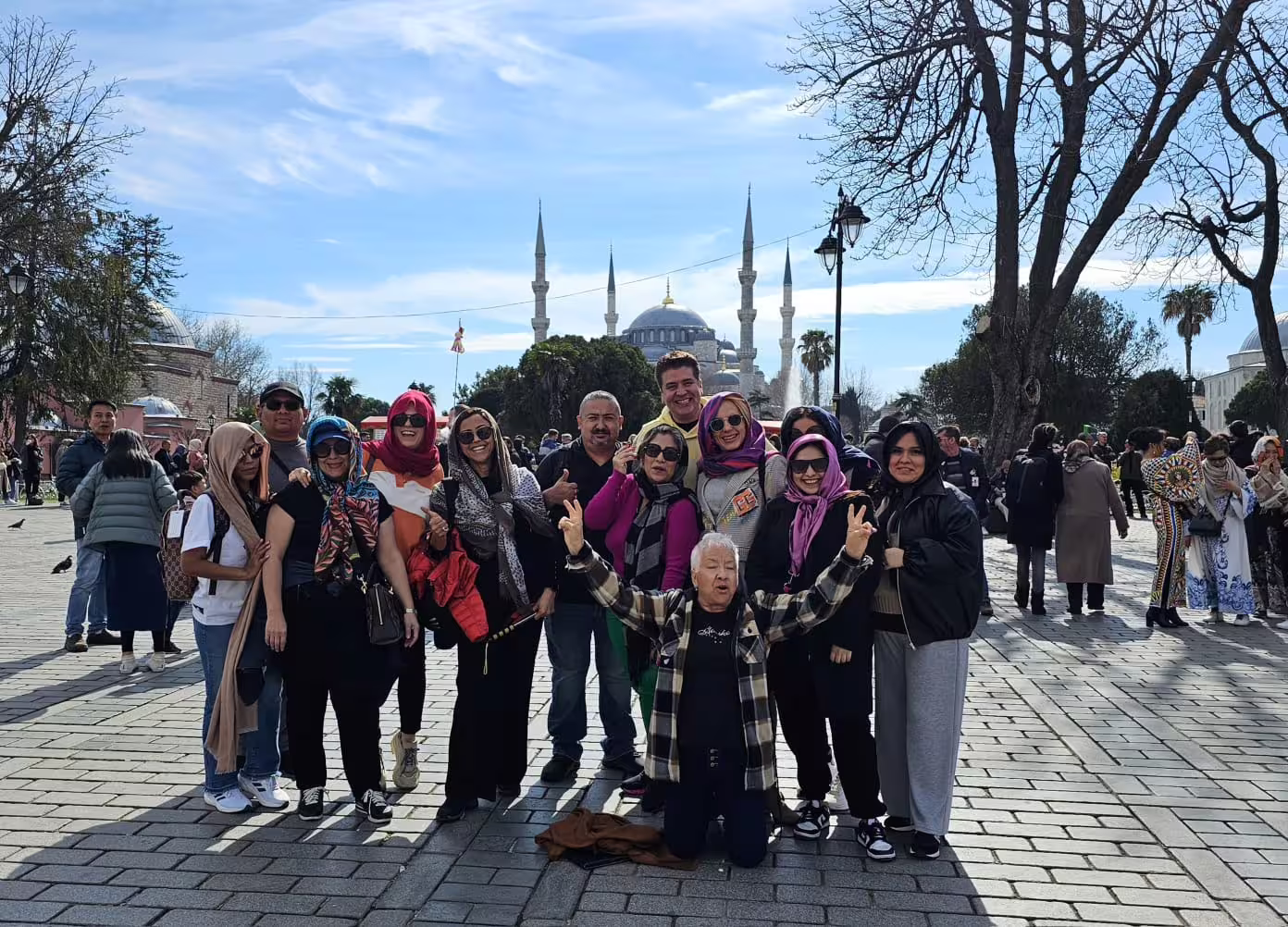 Mini group tour photo at Sultanahmet Square with Blue Mosque backdrop on 7-hour Istanbul tram tour
