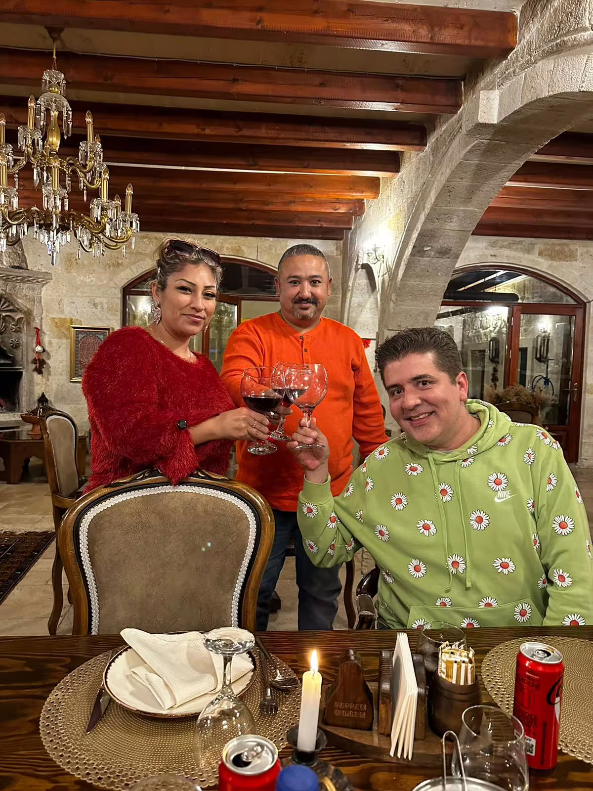Travelers toast in a historic Istanbul restaurant during a private 7-hour tram tour, local dining experience