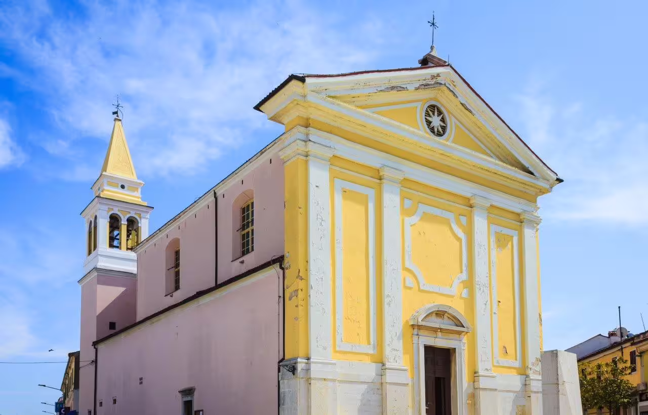 Pastel yellow church facade in Istria, Croatia, a charming stop on the 8-day self-drive Istria and Dalmatia tour