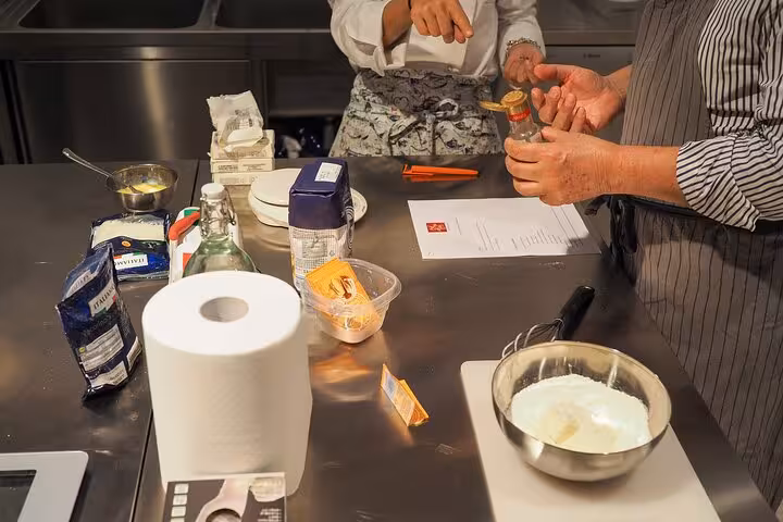 Hands-on Italian cooking class with an Italian chef guiding participants through authentic recipe preparation.