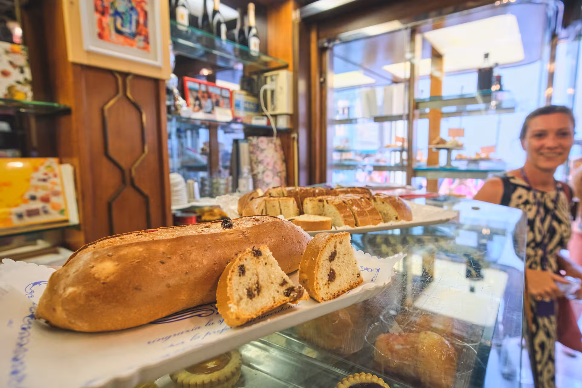 Delicious Italian pastries on display at a charming bakery in Lucca, perfect for tasting on your day trip from Florence.