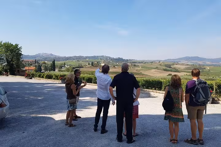 Small group enjoying Tuscany countryside viewpoint during 10-day private Italy tour from Rome to Venice