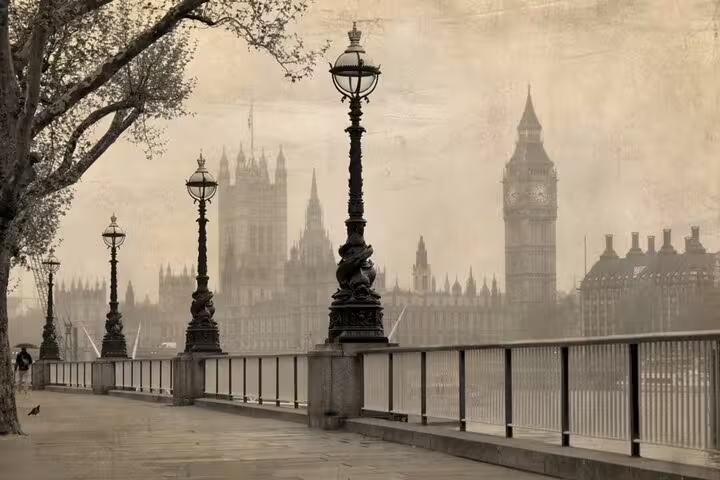 Foggy Victorian London riverside promenade with Big Ben and Houses of Parliament in sepia tone