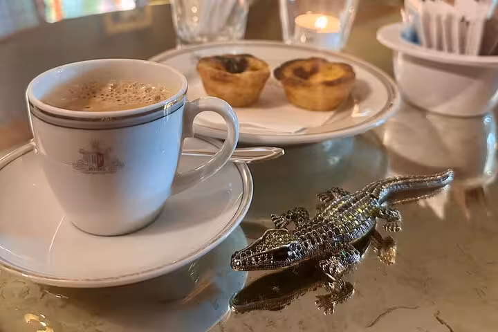 Enjoy a relaxing Sintra tour with coffee and traditional Portuguese pastries at a cozy café.