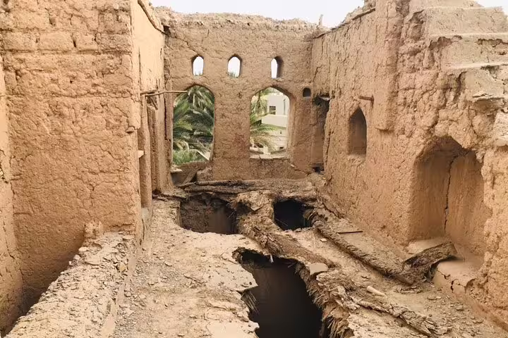 Explore ancient ruins on the Private Overnight Jebel Shams Camping Tour, showcasing historical architecture and desert heritage.