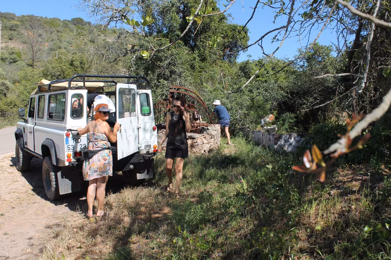 Guests stepping from a 4x4 Jeep safari into Algarve woodland, en route to Benagil cliffs coastline