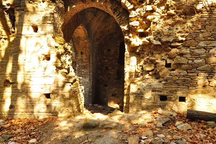 Sunlit ancient stone archway seen on a Jeep Safari tour from Kusadasi to the National Park.