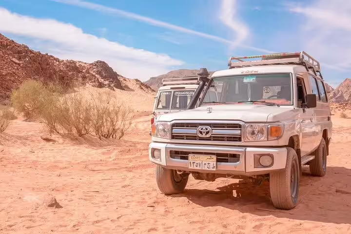 Close-up 4x4 jeep in Marsa Alam desert for Red Sea safari adventure tour with Bedouin dinner and show