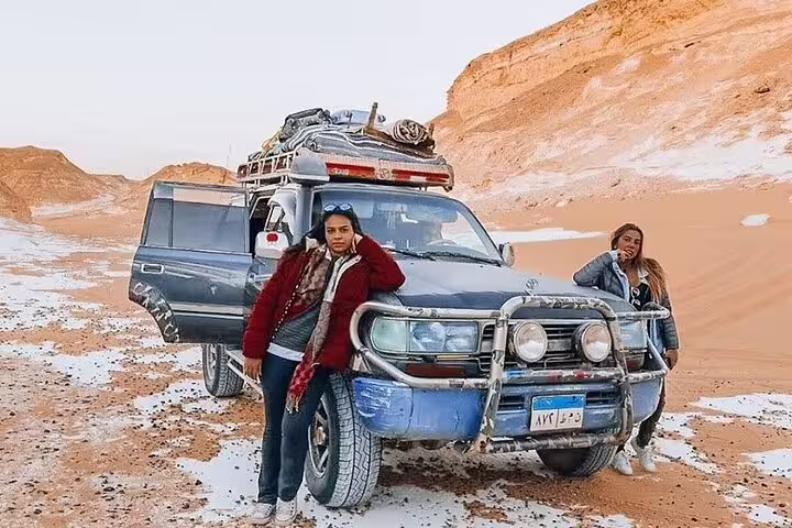 4x4 jeep safari in Egypt’s White Desert with travelers, part of 5-day Djara Cave and desert camping adventure