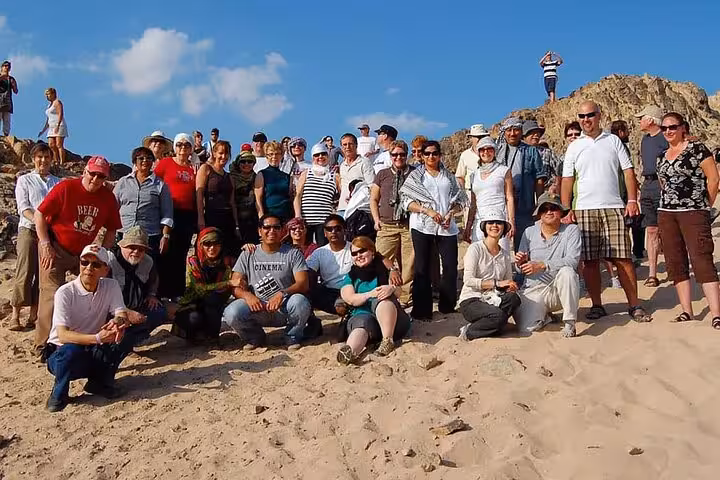 Group photo at rocky desert hills during Jeep Tour to Mons Claudianus, the forgotten Roman settlement in Egypt