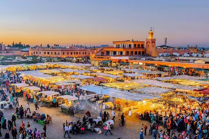 Jemaa el-Fnaa Marrakech at sunset, lively souk stalls and crowds, start of Anti-Atlas Sahara 8-day tour