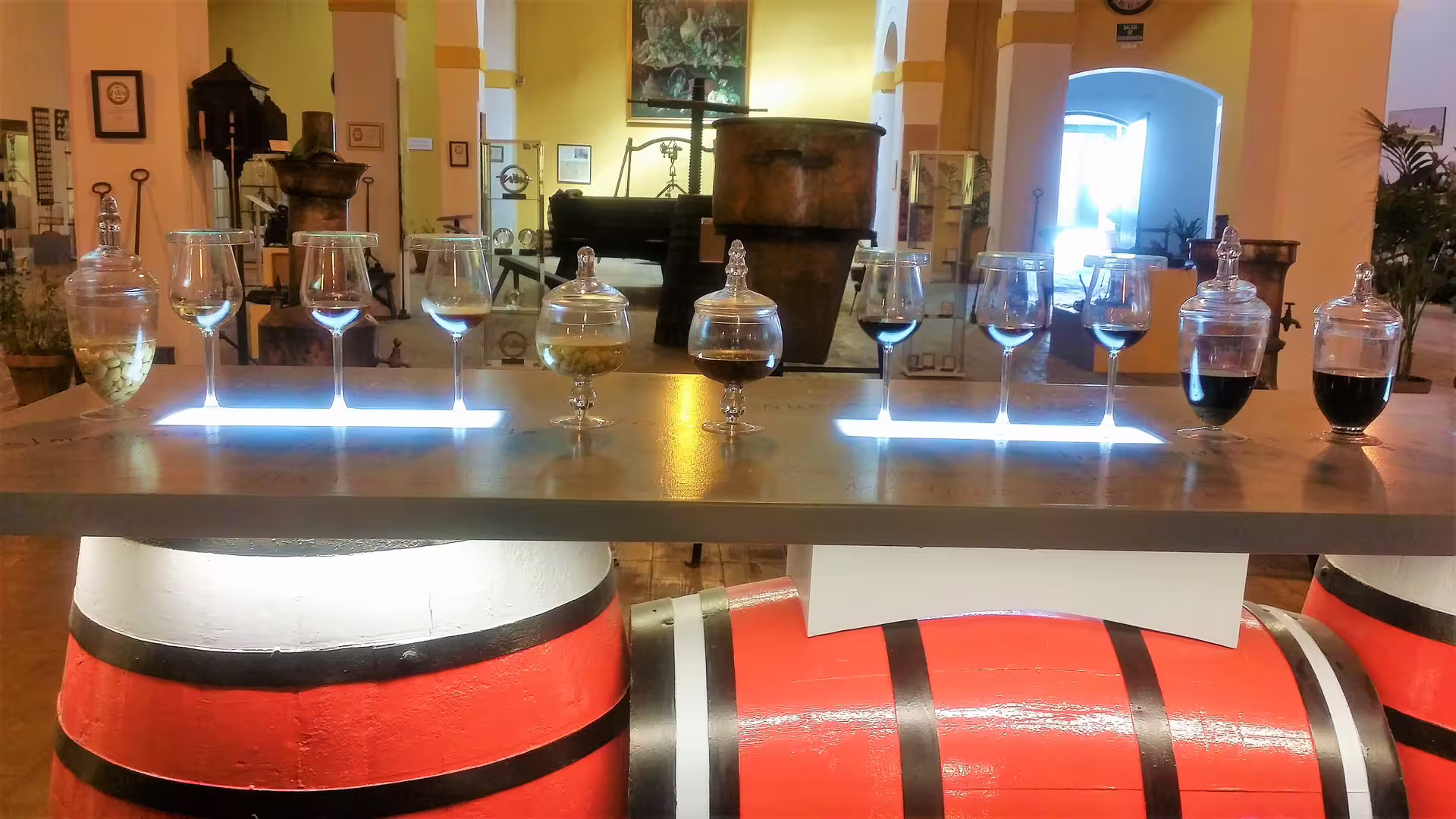 Sherry tasting display with wine glasses in a Jerez bodega museum on private tour from western Costa del Sol hotel pick-up