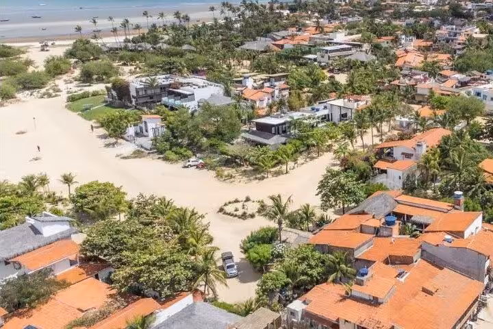 Aerial view of Jericoacoara village near the beach, ideal airport transfer drop-off for Jeri hotels