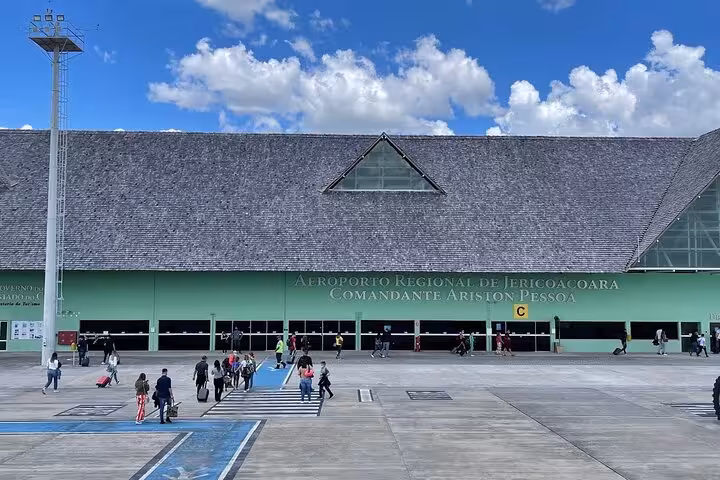 Travelers arriving at Aeroporto Regional de Jericoacoara for a guided reliable airport transfer service