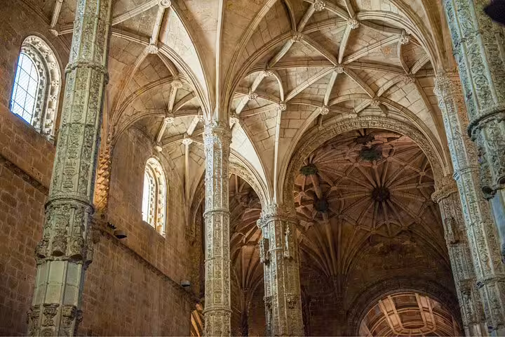 Intricate Gothic architecture inside Jerónimos Monastery, a highlight on the Lisbon and Belem private bike tour.