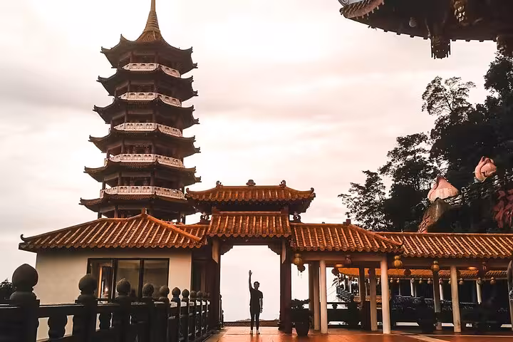 Visitor exploring a serene pagoda and traditional architecture on a Jervis Bay private tour, ideal for cultural enthusiasts.