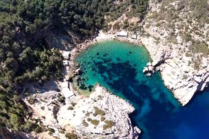 Aerial view of Portitxol bay, Javea with clear blue water and rugged coastline, highlight of jet ski tour