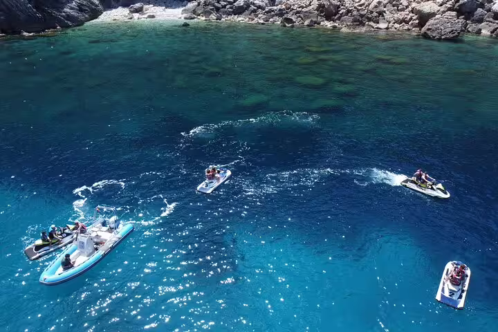 Aerial view of jet ski tour from San Antonio Ibiza to Margaritas Islands over crystal-clear coves