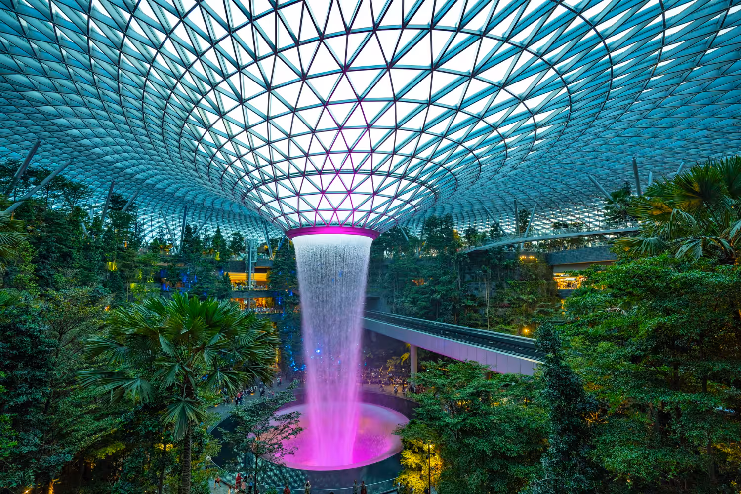 Jewel Changi Airport Rain Vortex waterfall inside lush forest, highlight of Canopy Park admission ticket