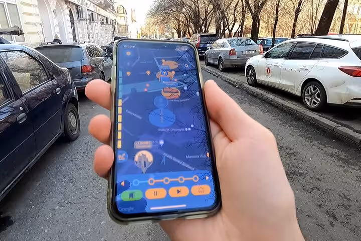 Traveler using Jewish Bucharest self-guided walking tour app with interactive GPS map navigation