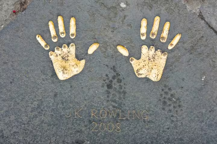Golden handprints of J.K. Rowling embedded in stone pavement, dated 2008, Edinburgh