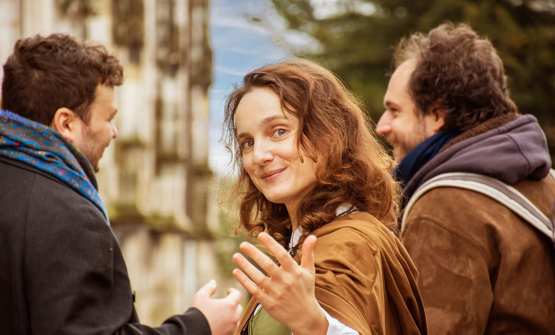 Woman in medieval costume gesturing during Joan of Arc walking tour in Rouen