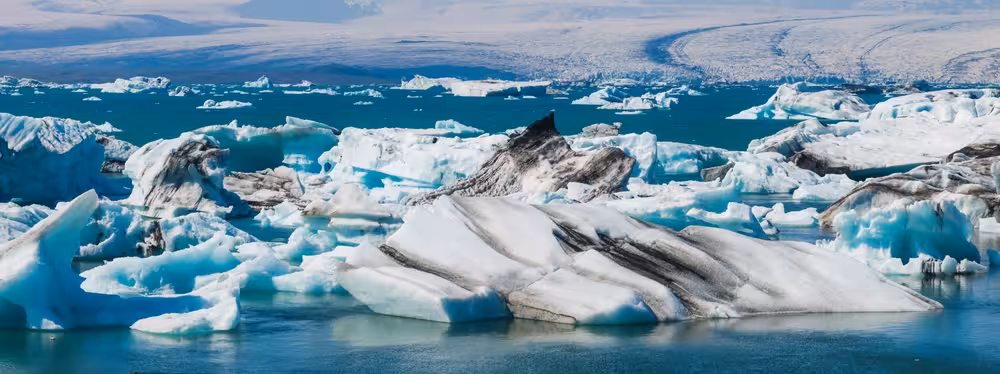 Icebergs floating in the blue glacial waters of Jokulsarlon glacier lagoon, Iceland
