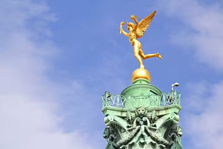 Golden winged angel statue atop the July Column at Place de la Bastille, Paris