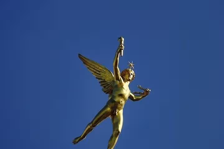 Golden statue atop the July Column at Place de la Bastille, a historic landmark in Paris featured on the tour.
