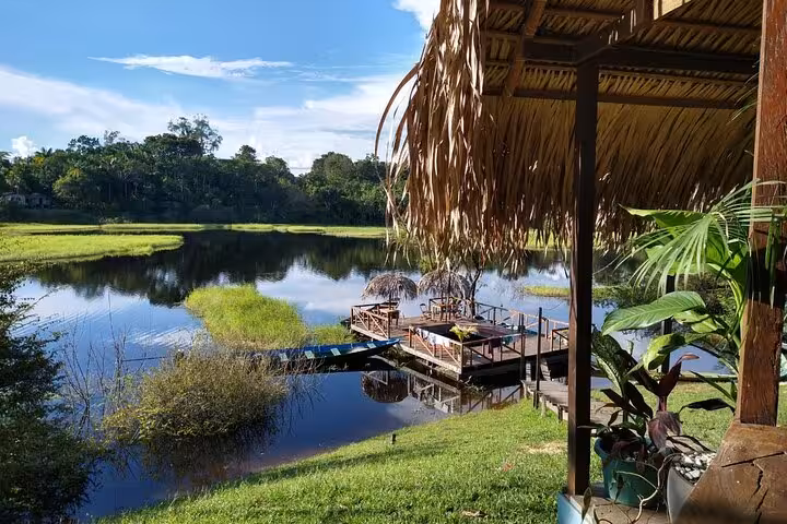 View from Juma Lake Lodge over tranquil Amazon lake and floating dock, ideal for a 2 days 1 night lodge stay