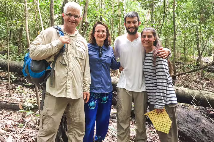 Happy tourists exploring lush jungle trails on the Tapiri Rio Negro Lodge adventure.