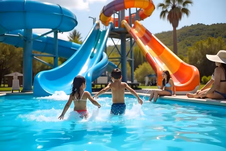 Family enjoying pool and water slides at Jungle Aqua Park Hurghada day tour with lunch and hotel transfer